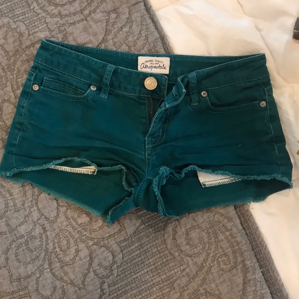 Teal jean shorts.